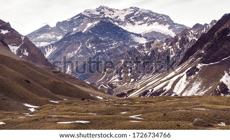 Aconcagua mountain with snow seen from the national park on an autumn day - Mendoza, Argentina.