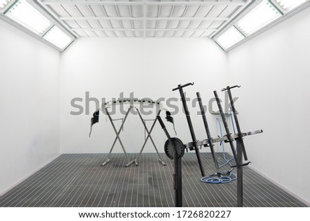 Car bumper after painting. Drying parts of the automobile in spray booth. Royalty-Free Stock Photo #1726820227