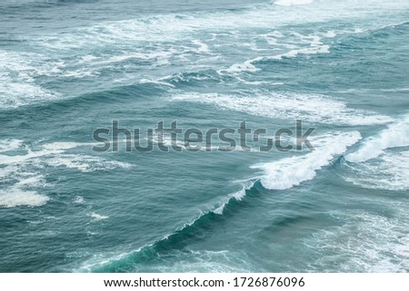 waves crashing at the shoreline