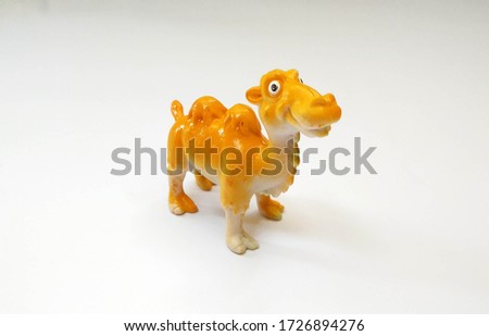 camel toys yellow color isolated white background