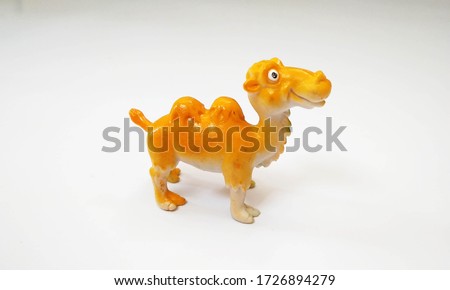 camel toys yellow color isolated white background right side