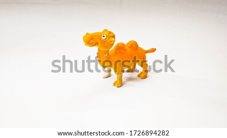 camel toys yellow color isolated white background left side