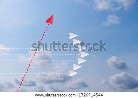 Red paper plane out of line with white paper to change disrupt and finding new normal way on sky background. Lift and business creativity new idea to discovery innovation technology.