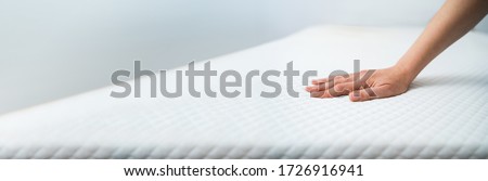 Memory Foam Mattress Or Topper. Choosing Bed In Store  Royalty-Free Stock Photo #1726916941