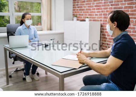 Job Interview Business Meeting At Law Office Wearing Face Mask Royalty-Free Stock Photo #1726918888