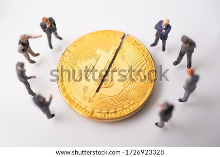 business miniature consultation meeting , Cryptocurrency bitcoin with cutting traces. sign of bitcoin halving that gennerate half of the  bitcoin from computer computing process