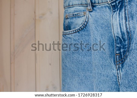  Jeans and denim jacket close-up in blue with straight seams. Wardrobe Update. Top view. Flat lay composition