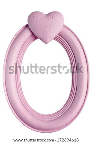 Empty oval shape pink frame with carved heart on top isolated on white background. Useful for design and ready to insert any picture inside