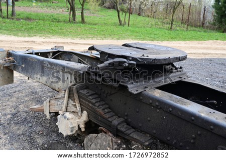 Photo of broken truck parts outdoors