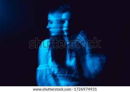 portrait of a crazy mentally ill girl with mental disorders on a dark background
