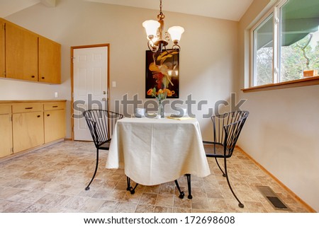 Dining room with metal kitchen table set and tile floor
