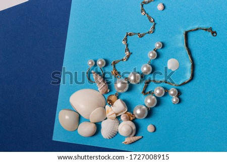 Jewelry set composition on trendy color block paper background. Summer time concept. Creative flat lay, top view