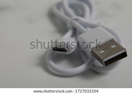 usb to micro-usb cable isolated on marble background