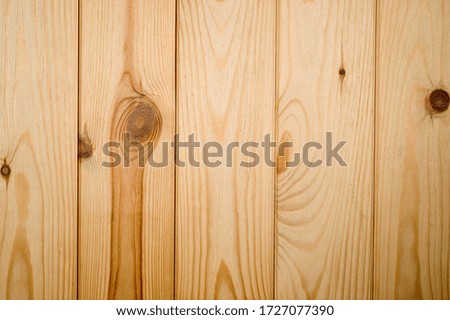The texture of a wooden background consisting of unpainted boards intended for photographs.