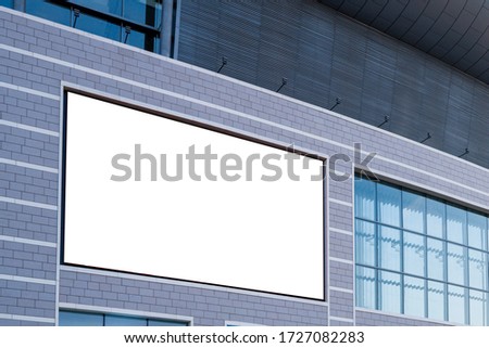 empty billboard on the building wall.