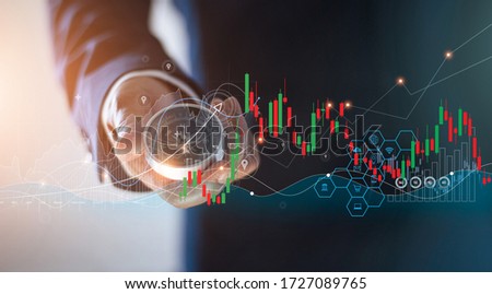 Abstract, A businessman holding a compass to navigate the business with marketing of icons and business growth graphs, Stock market and data exchange.