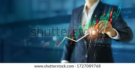 A businessman drawing business growth graphs, Analysis, strategy and planning, Marketing and Stock market, data exchange.