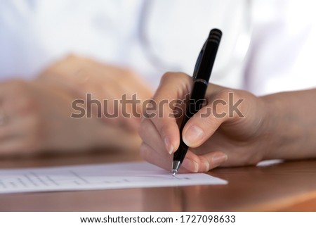 Close up of female patient put signature on paper document close deal with doctor in hospital, woman client sign paperwork contract making health insurance agreement with GP at meeting Royalty-Free Stock Photo #1727098633