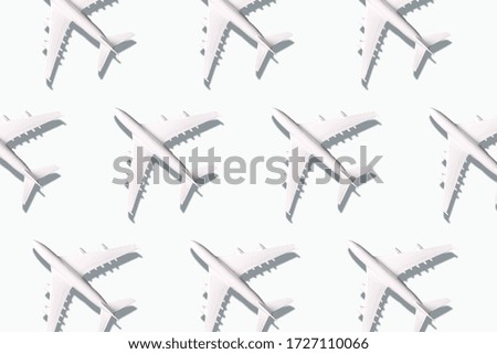 Summer pattern. Creative banner of planes on white background. Travel, vacation concept. Travel, vacation ban. Flights cancelled and resumed again. Top view. Flat lay. Minimal style design
