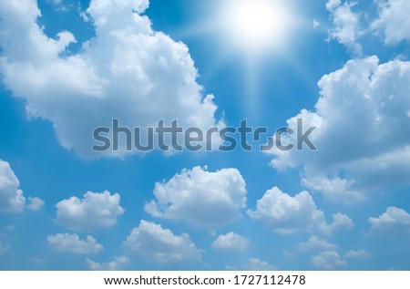 Sun and clouds and blue sky on a clear day