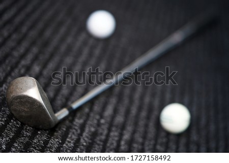 Golf club and ball on a black background close-up. Accessories for a sports game. Match                               