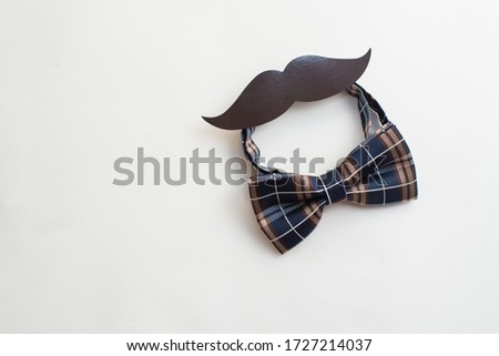 Father's day. Men's bow tie and mustache paper. Space for text. Copy space
