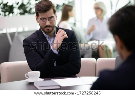 Two business men partners during meeting in office. Negative attitude to applicant, bad first impression, hr manager looking at candidature with distrust, unsuccessful, failed job interview concept Royalty-Free Stock Photo #1727258245