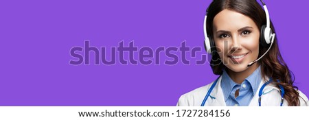 Medical call center servise. Online helping and consultation. Portrait of female doctor in headset, against purple violet background, with copy space empty place for some sign text or slogan.