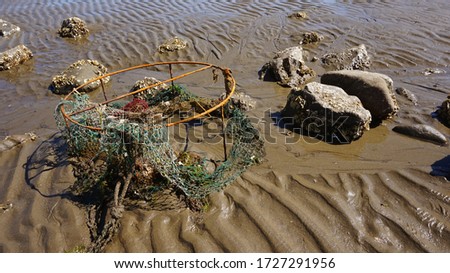The corroded trash discarded in the sea. Corroded fishing nets
