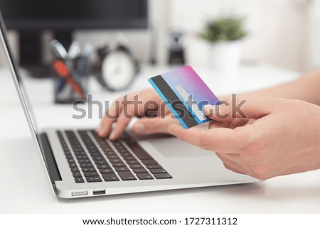 Credit card in hand. Online shopping, e-commerce concept