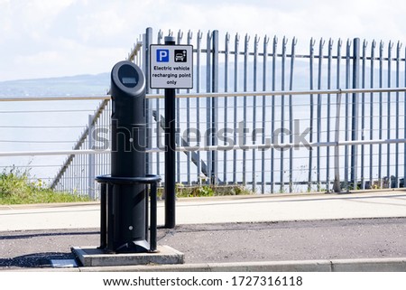 Electric recharging point for vehicle car or bike free no charge in car parking space