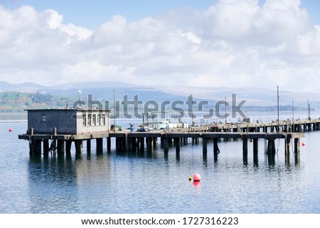 Old fishing pier jetty abandoned and derelict in Greenock Inverclyde
