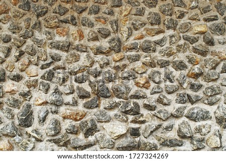 Stone Wall concreted textured seamless background and wallpaper