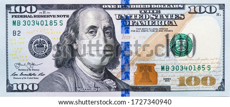 A $ 100 bill in a medical mask. World economy during the COVID-19 pandemic Royalty-Free Stock Photo #1727340940