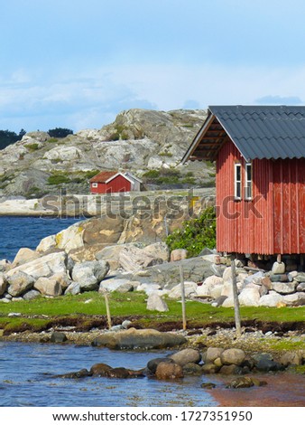 Burgundy wooden houses and landscapes in the Koster, Sydkoster and Nordkoster islands. Archipielago of Kosterhavets Nationalpark. Stromstad. Bohuslan. Sweden. Royalty-Free Stock Photo #1727351950