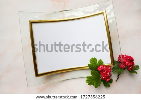 greeting card mockup. flowering branch with red flowers and space for text. invitation. congratulation.