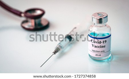 Vaccines Stethoscope
and syringes ,Vaccine vial dose flu shot drug needle syringe, medical,concept vaccination hypodermic injection treatment disease care hospital prevention immunization .