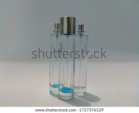 3 bottles of perfume that are almost out of contents.