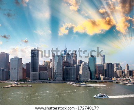 East river and Manhattan skyline at dusk, aerial view of New York.