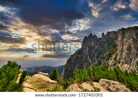 The magnificent view from Ai-Petri mountain, Crimea, at sunrise. Crimean Mountain cloudy landscape. Clouds are painted by flowers of dawn. Mountain "Ay Petri". Beautiful view. Royalty-Free Stock Photo #1727403301