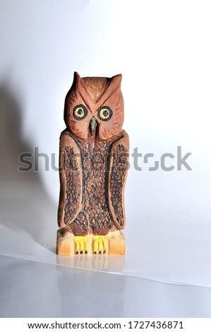 Owl figurine carved from wood