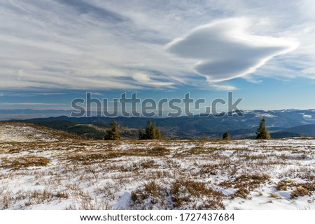 Panoramic scenic view on top of a snowed mountain	