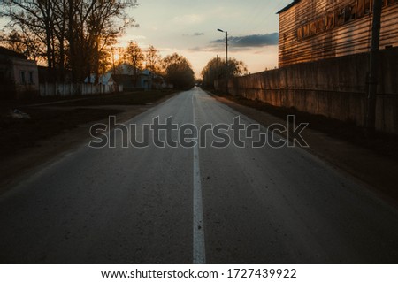 Road going into the distance at sunset