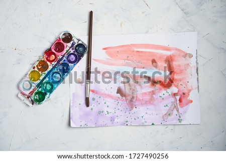 Set of watercolor paints white background. Brushes drawing. Creative background. School for teaching drawing. With copy space for text