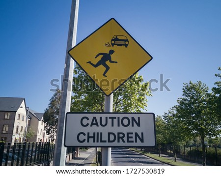 caution children road yellow sing