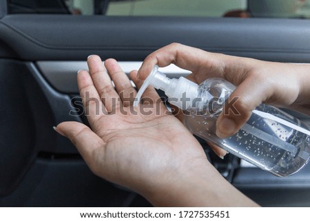 Hand sanitizer prevent virus and plague infection, prevent covid-19 virus, picture in the car