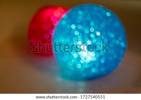 abstract vision of defocused two blurring circles red and blue. abstract background picture red and blue many bokeh