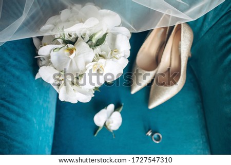 bride's bouquet, shoes, wedding rings and a set of invitations. The bride's accessories. Wedding morning.
