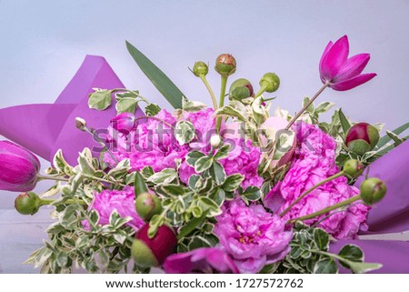 Fresh, lush bouquet of colorful flowers. Flowers frame on white wooden background. Top view with copy space.