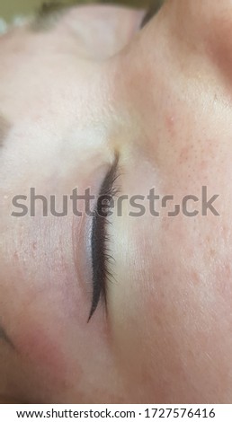 black permanent makeup  eyeliner right after the procedure without photo correction. 